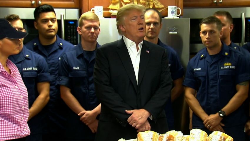 POTUS and FLOTUS greet the wife and son of one of the commanding officers, who are standing by the food -- at  Coast Guard station Lake Worth in Florida
