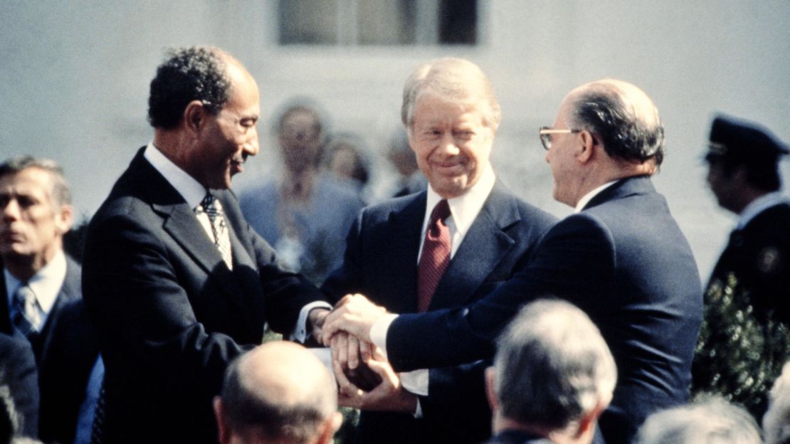 US President Jimmy Carter (C) congratulates Egyptian President Anwar al-Sadat (L) and Israeli Premier Menachem Begin (R) in March 1979 after the signature of their historic peace treaty.