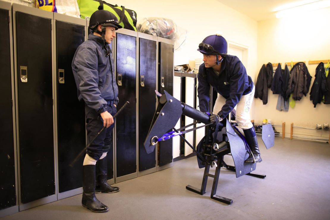 Owen receives advice from retain jockey Richard Kingscote the day before race.