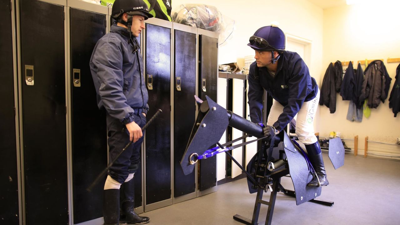 Owen receives advice from retain jockey Richard Kingscote the day before race.