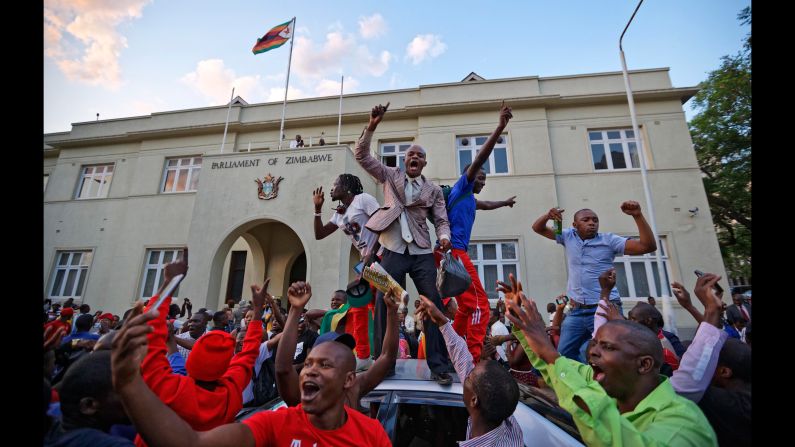 People celebrate outside the Parliament building in Harare, Zimbabwe, after <a href="http://www.cnn.com/2017/11/21/africa/robert-mugabe-resigns-zimbabwe-president/index.html" target="_blank">the resignation of longtime President Robert Mugabe</a> was announced on Tuesday, November 21. Mugabe, 93, had led the country for nearly four decades. His resignation came six days after military leaders seized control of the nation and placed him under house arrest.