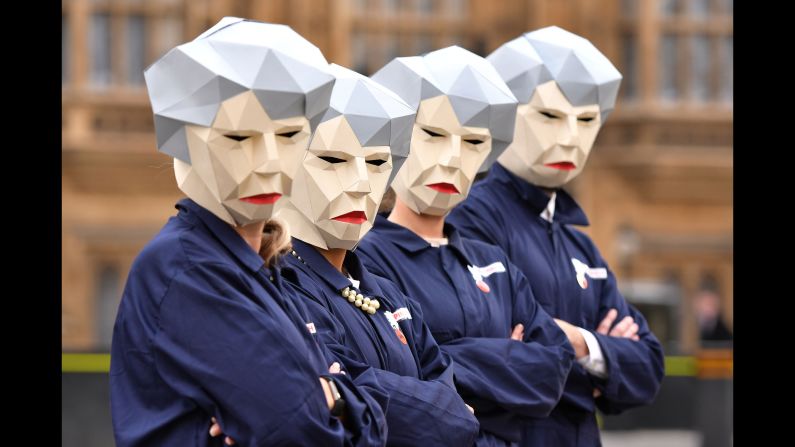 Members of the GMB trade union are dressed as "Maybots" as they protest outside London's Parliament on Wednesday, November 22. They were wearing the costumes, based on British Prime Minister Theresa May, as they made a last-ditch plea for public-sector workers to get a pay raise.