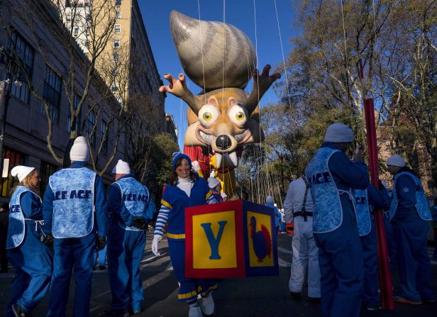 A balloon of Scrat, the squirrel from the movie "Ice Age," floats in the sky before the start of the Macy's Thanksgiving Day Parade in New York City.