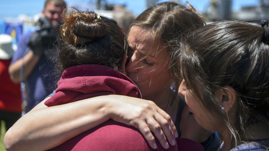 A relative of one of the 44 crew members in the missing submarine is  comforted outside Argentina's Navy base in Mar del Plata on November 23.