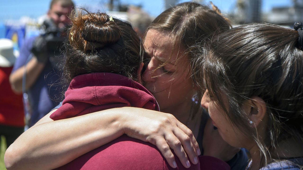 A relative of one of the 44 crew members in the missing submarine is comforted outside Argentina's Navy base in Mar del Plata on November 23.