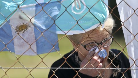 A woman cries outside the Mar del Plata naval base after learning that a sound detected during the search for the missing ARA San Juan submarine is consistent with that of an explosion.