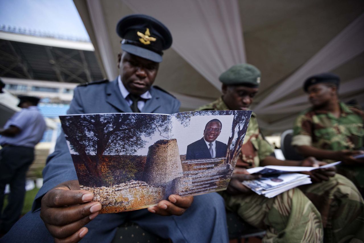 A Zimbabwe Air Force officer reads an inauguration program ahead of the ceremony.