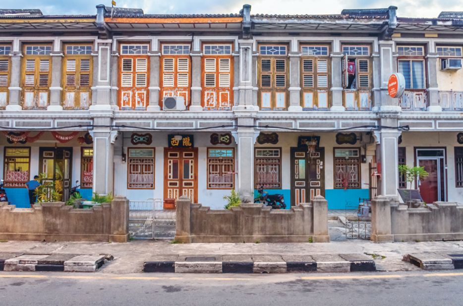 The wood-and-stone fronts of this colonial-era buildings in Malacca, Malaysia express the region's diverse cultural influences.