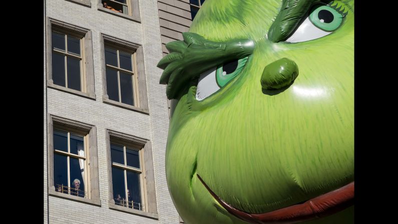 The Grinch balloon passes by windows during the <a href="http://www.cnn.com/2017/11/23/us/gallery/macys-thanksgiving-day-parade-2017/index.html" target="_blank">Macy's Thanksgiving Day Parade</a> in New York City. <a href="http://www.cnn.com/2013/11/23/us/gallery/macys-thanksgiving-day-parade-balloons/index.html" target="_blank">See historic photos from past parades</a>