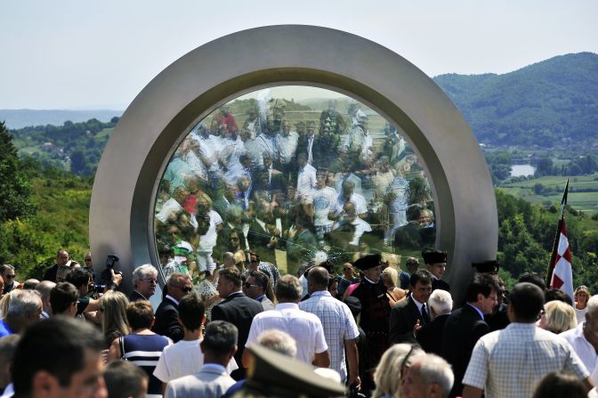 Designed by Croatian architects NFO, the giant lens features a single bullet hole in its center. 