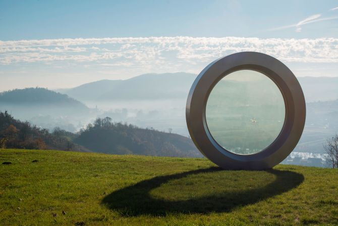 This over-sized camera lens sits on top of Čukur hill in Banovina, Croatia, where photographer Gordan Lederer was shot by a sniper in 1991. 