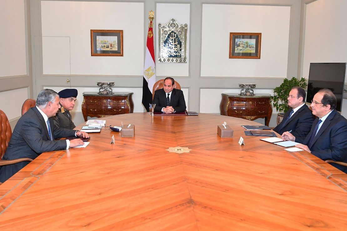 President Abdel Fattah el-Sisi, center, meets with officials in Cairo after the mosque attack.