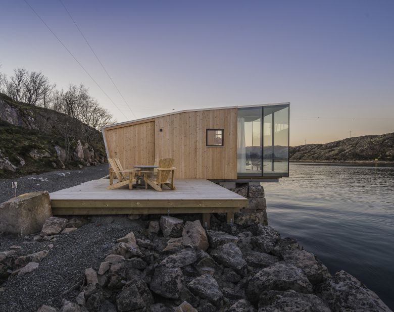 Consisting of four cabins that sit on the former fishing island, the project was commissioned by polar explorer Børge Ousland. 