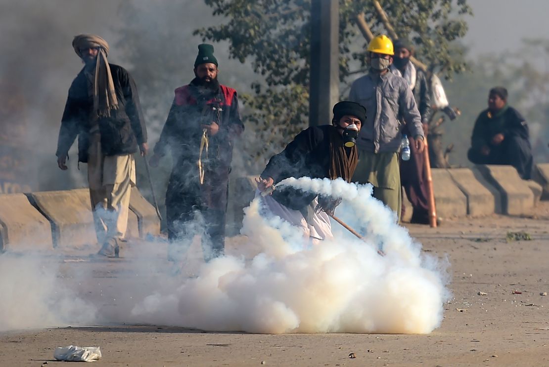 Protesters threw tear gas shells back to police during a clash on Saturday.