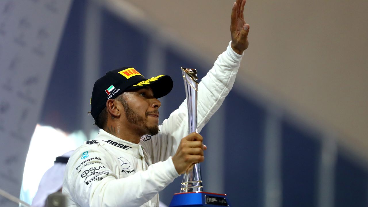 ABU DHABI, UNITED ARAB EMIRATES - NOVEMBER 26:  Second place finisher Lewis Hamilton of Great Britain and Mercedes GP celebrates with his trophy on the podium during the Abu Dhabi Formula One Grand Prix at Yas Marina Circuit on November 26, 2017 in Abu Dhabi, United Arab Emirates.  (Photo by Dan Istitene/Getty Images)