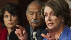 US Representatives Lucille Roybal-Allard (L), D-CA, and John Conyers (C), D-MI, listen as US House Minority Leader Nancy Pelosi (R), D-CA, calls on Republicans to return to work because "We Can't Wait" on the payroll tax cut extension and unemployment insurance bills, January 5, 2012 on Capitol Hill. Democrats are highlighting the GOP's one year aniversary leading the House of Representatives without a jobs agenda.