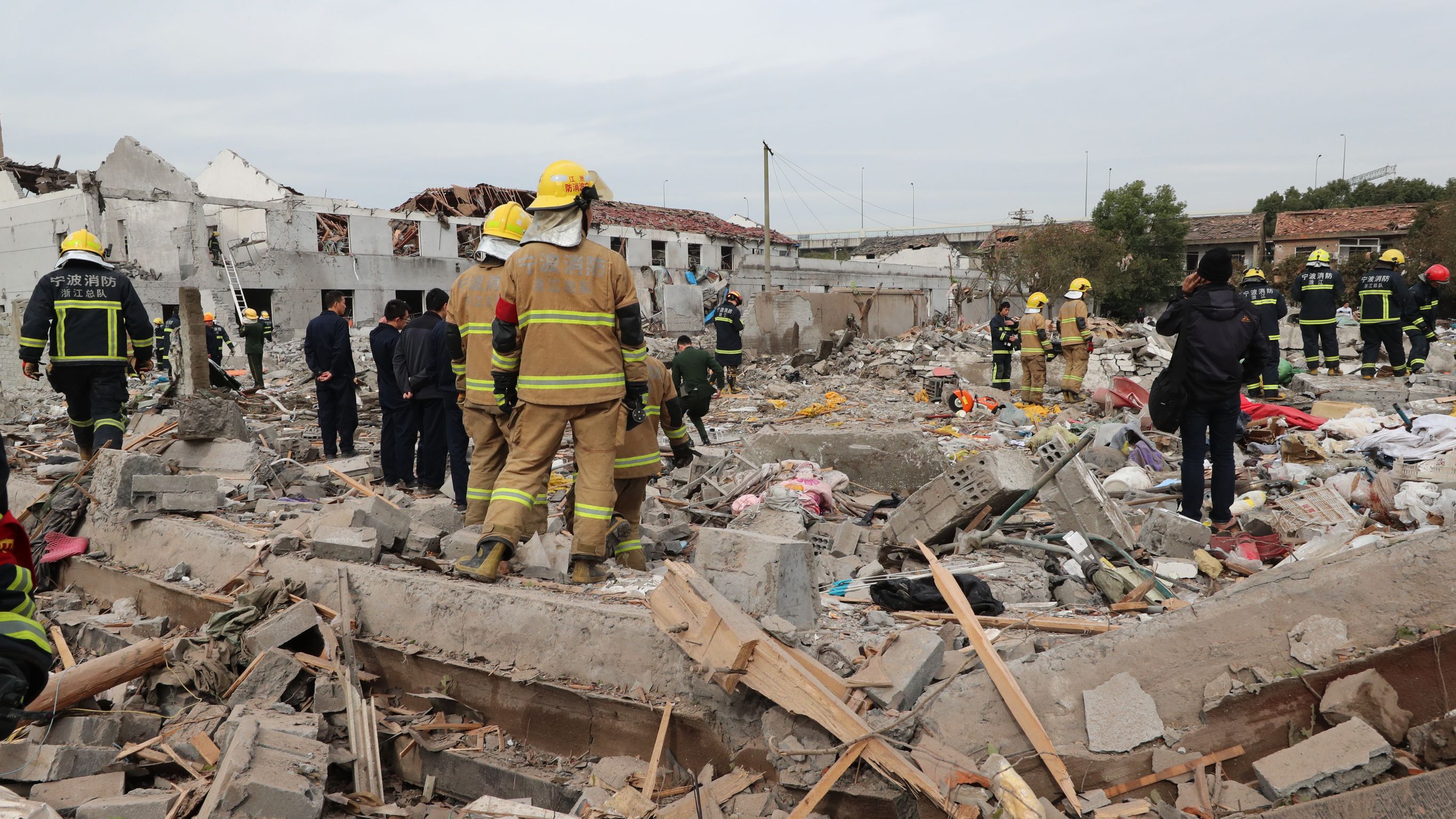 Rescue workers search the blast site.