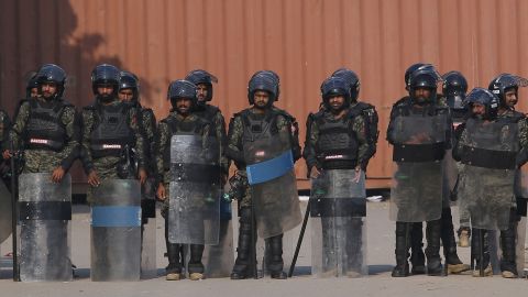 Pakistani paramilitary soldiers stand guard at a closed road leading to the sit-in.