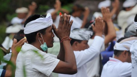 Balinese Hindus take part in a ceremony, where they pray near Mount Agung in hope of preventing a volcanic eruption on November 26.