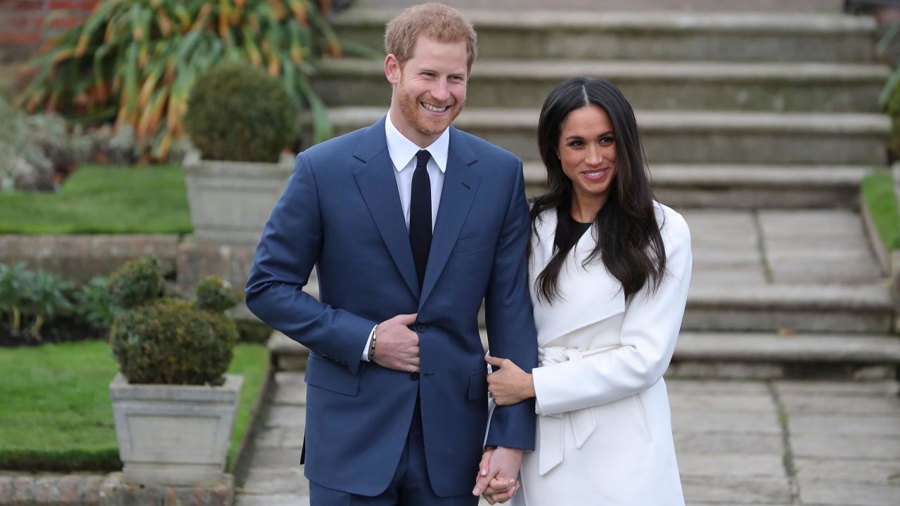 Prince Harry and fiancée Meghan Markle pose for photographers after their engagement was announced Monday. 