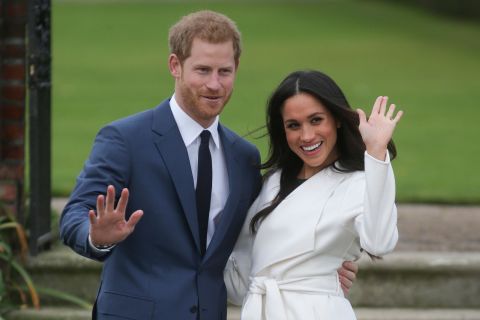 Markle and Prince Harry pose for a photo at Kensington Palace following the <a href=