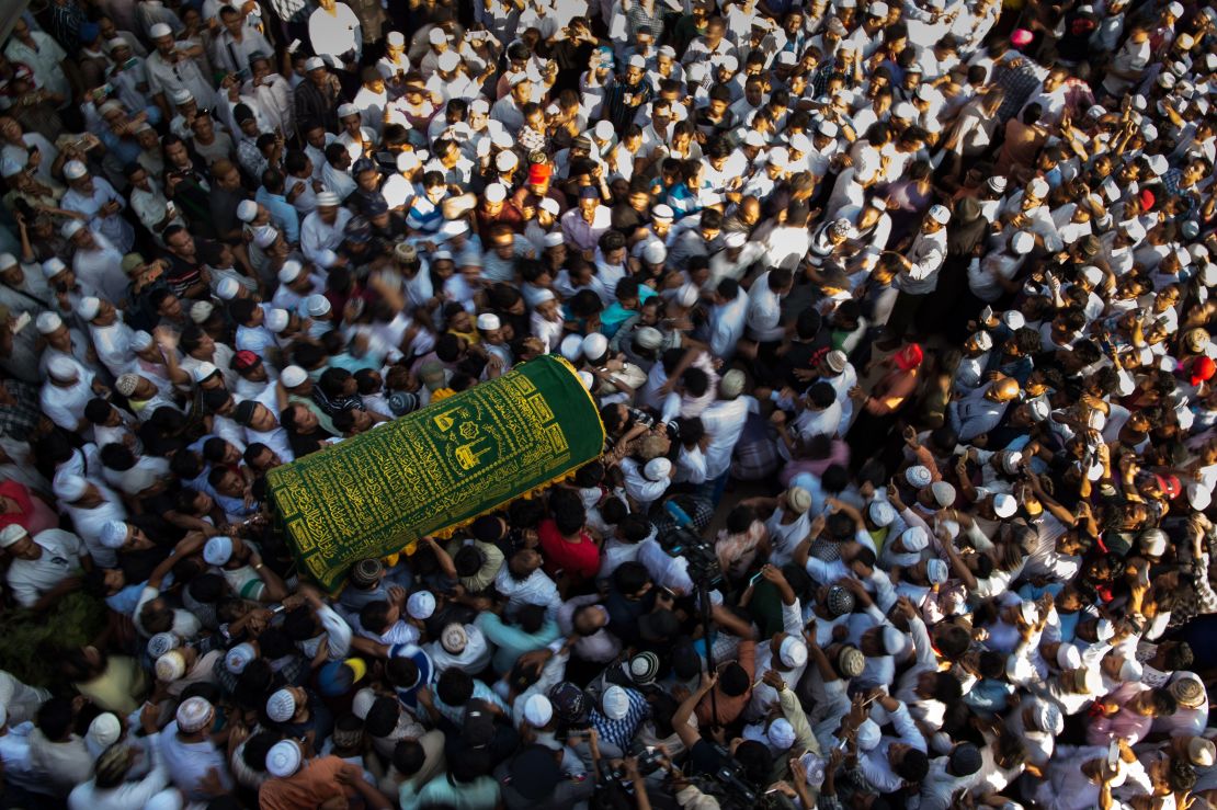 Mourners carry the coffin of Ko Ni, prominent Muslim lawyer who was shot dead on January 29, at the Muslim cemetery in Yangon on January 30, 2017. 
