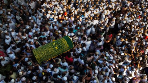 Mourners carry the coffin of Ko Ni, prominent Muslim lawyer who was shot dead on January 29, at the Muslim cemetery in Yangon on January 30, 2017.
