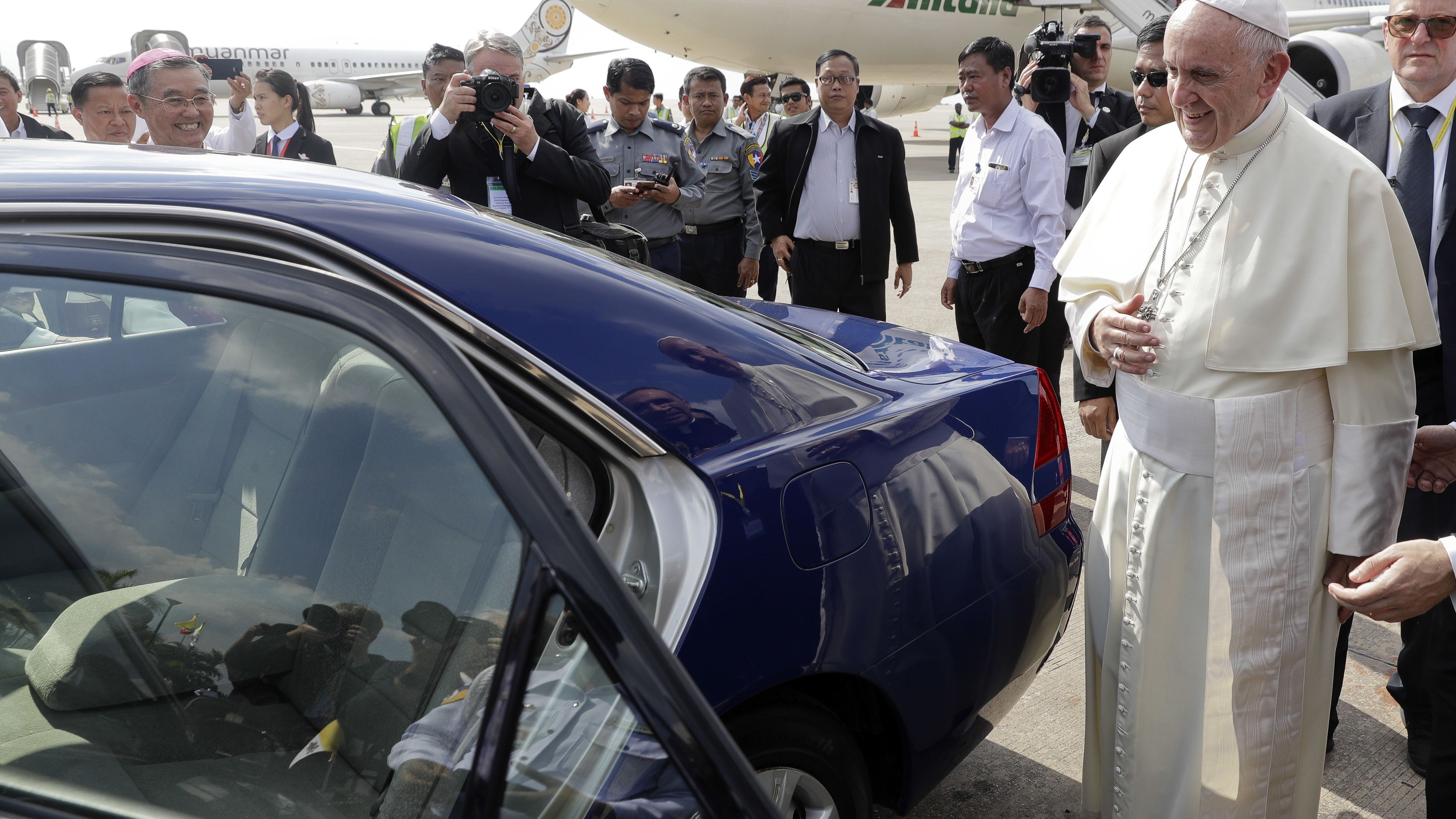 Pope Francis prepares to leave the airport.