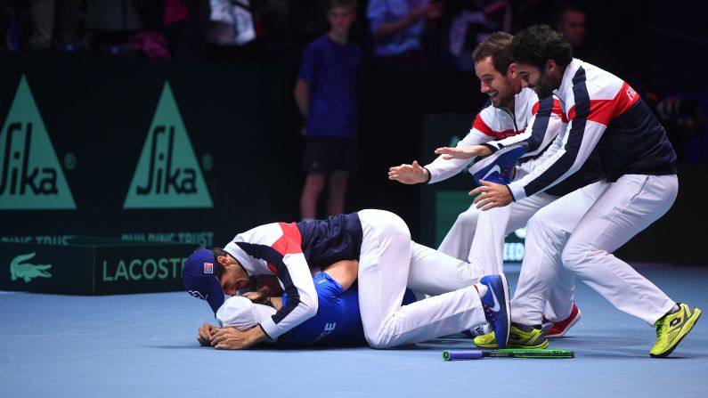 Tennis player Lucas Pouille is mobbed by his French teammates after his victory clinched the Davis Cup in Lille, France, on Sunday, November 26. France defeated Belgium <a target="_blank">in the final.</a> It is France's 10th Davis Cup and its first since 2001.