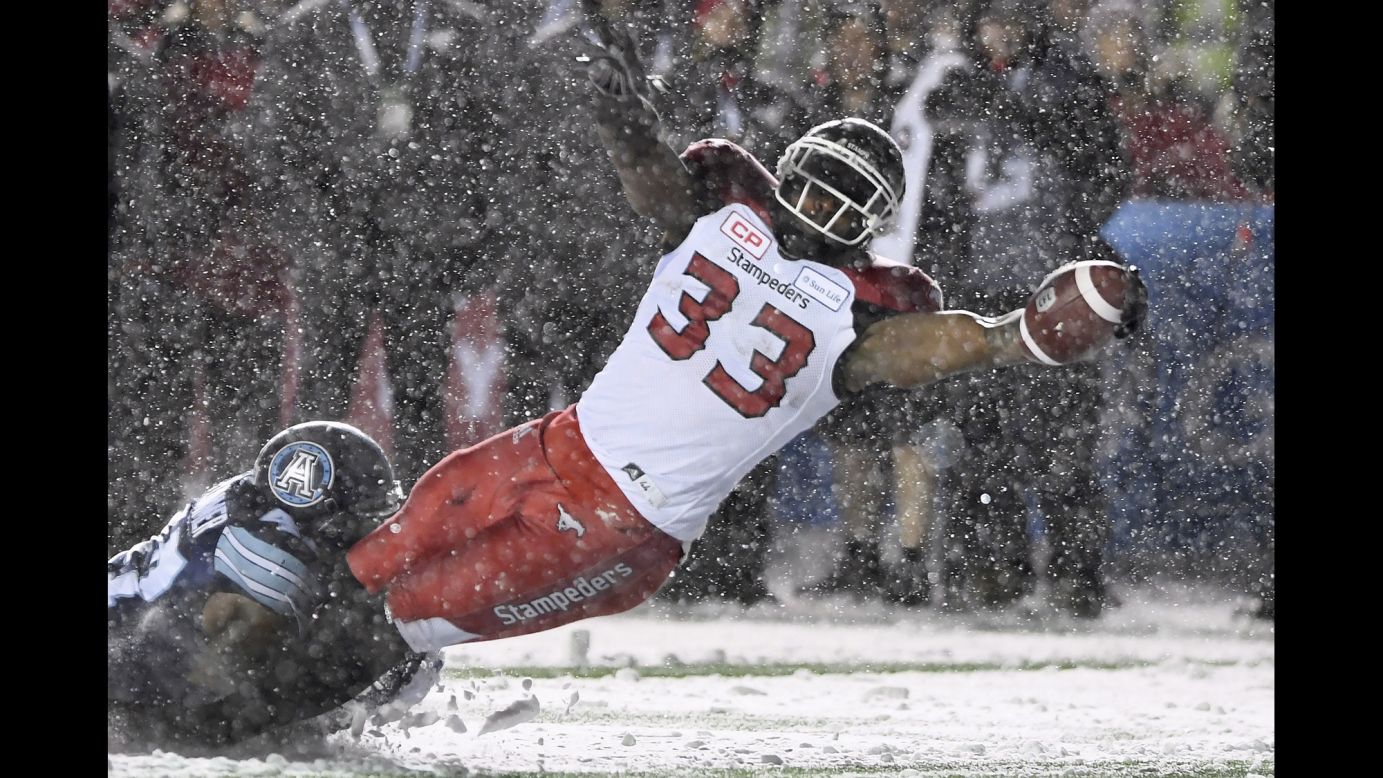 Toronto's Terrance Plummer tackles Calgary's Jerome Messam in the Grey Cup, the championship game of the Canadian Football League, on Sunday, November 26. Toronto won 27-24 for its league-record 17th title.