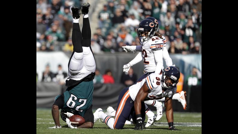 Philadelphia running back LaGarrette Blount is upended by Chicago's Adrian Amos, lower right, during an NFL game in Philadelphia on Sunday, November 26.