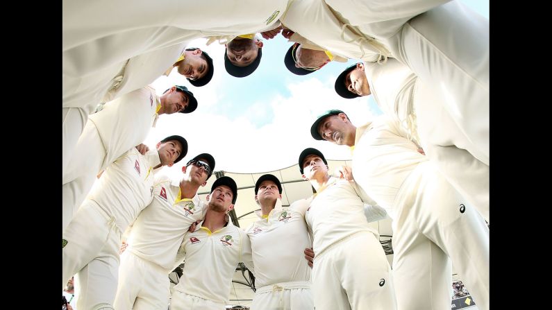Australia's cricket team huddles up before taking the field against England on Saturday, November 25. Australia won the first Test match of the latest Ashes series. The second match starts Friday.