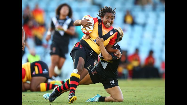 Papua New Guinea's Della Audama is tackled during a Rugby League World Cup match against New Zealand on Wednesday, November 22.
