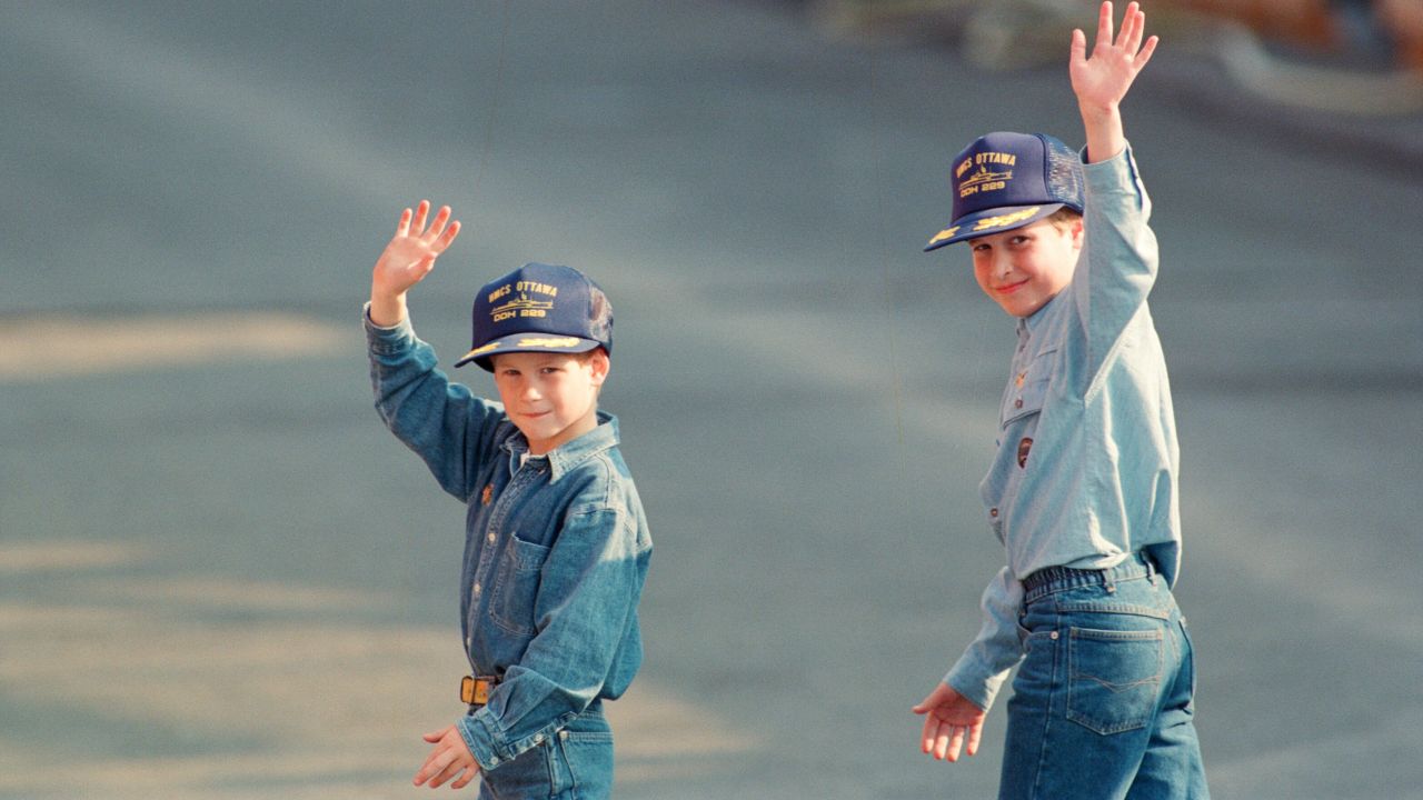 Harry, left, and William wave to the cameras during a 1991 tour of Canada. The caps were given to them by the crew of the Canadian frigate HMCS Ottawa.