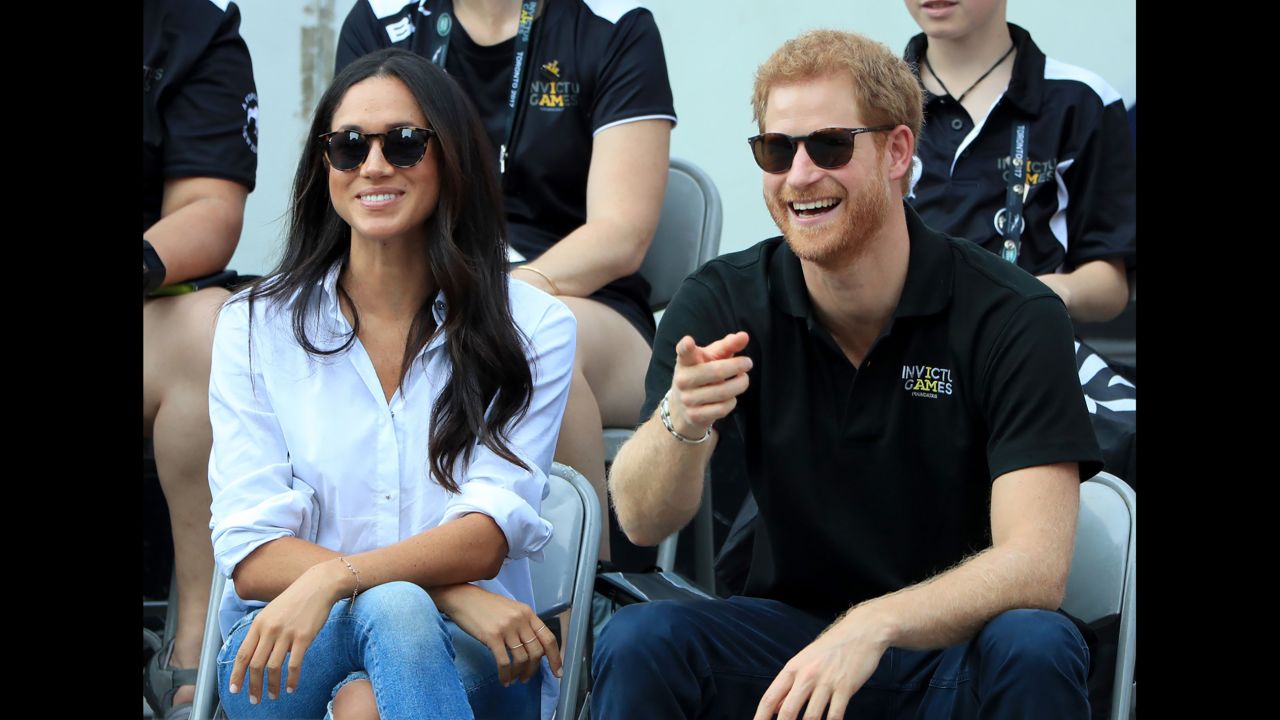 Harry watches wheelchair tennis with his girlfriend, Meghan Markle, at the Invictus Games in September.