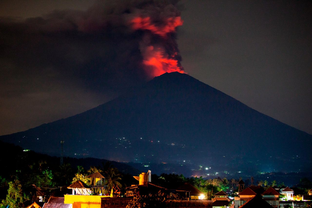 Mount Agung spews volcanic ash into the night sky on November 27,  near Karangasem, Bali, Indonesia.  