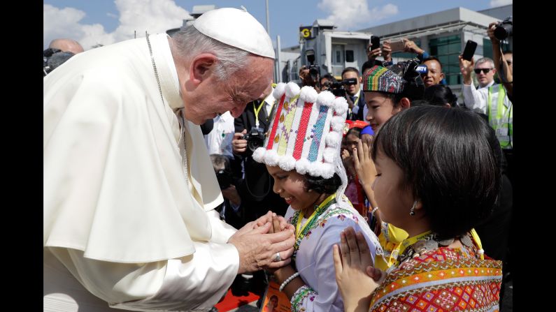 Pope Francis is welcomed by children on November 27. 