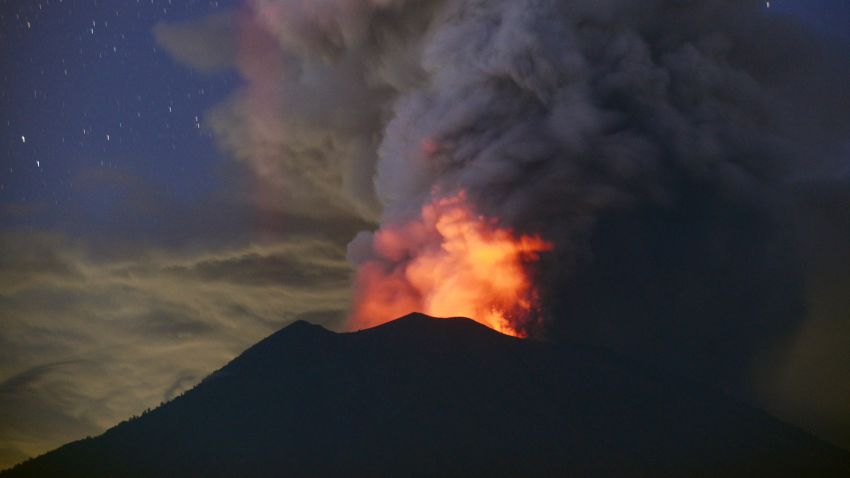 A general view shows Mount Agung erupting seen at night from Kubu sub-district in Karangasem Regency on Indonesia's resort island of Bali on November 28, 2017. 
Indonesian authorities extended the closure of the international airport on the resort island of Bali for a second day over fears of a volcanic eruption. / AFP PHOTO / SONNY TUMBELAKA        (Photo credit should read SONNY TUMBELAKA/AFP/Getty Images)