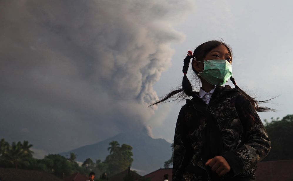 An elementary school student wears a face mask on school grounds before school in Karangasem, Bali, Indonesia, on November 28.