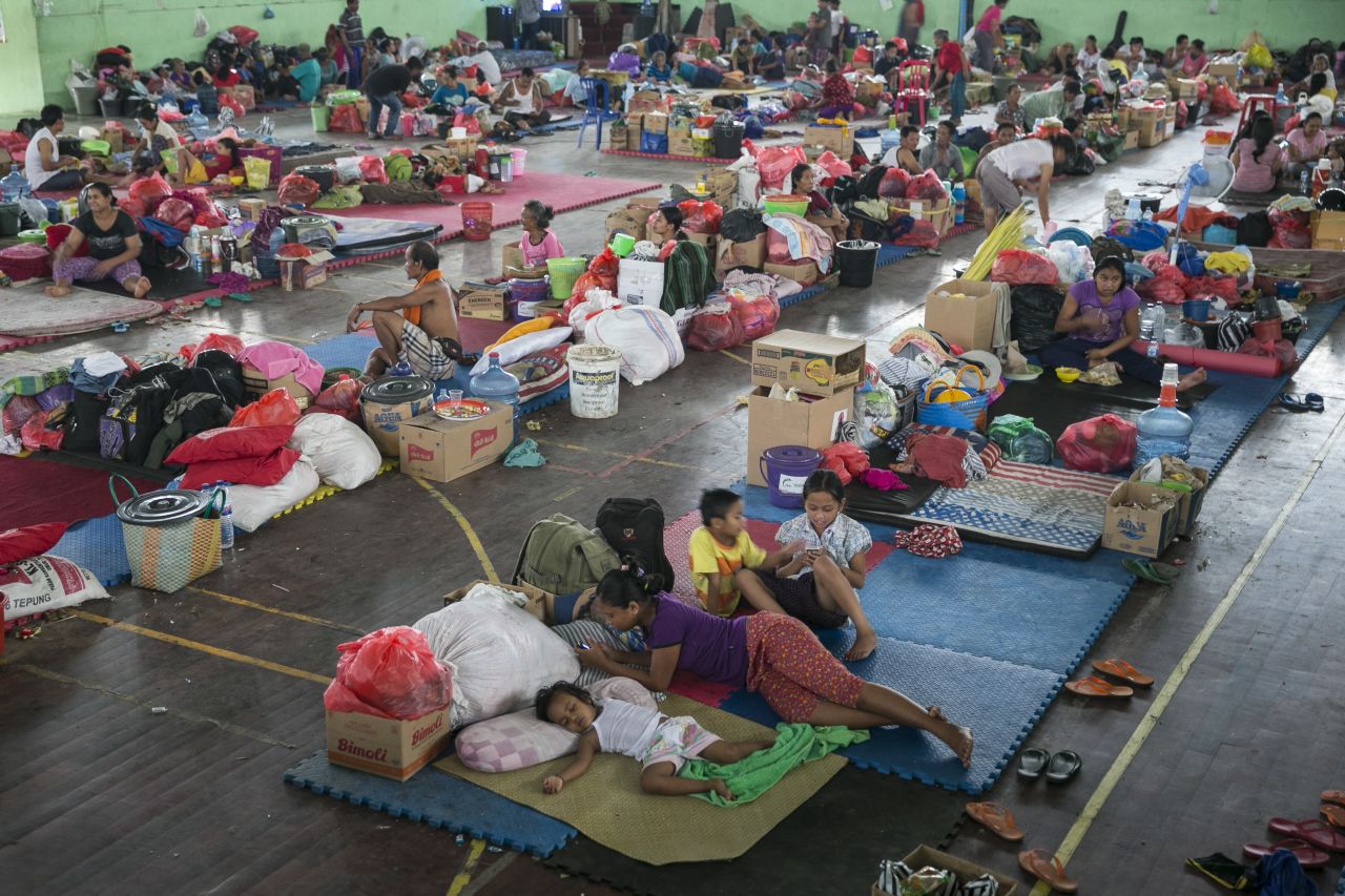 Evacuees fill an emergency shelter in Klungkung, Bali, Indonesia, on Monday,  November 27 