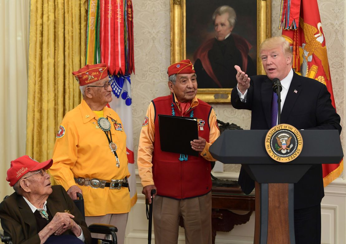 President Donald Trump speaks during a meeting with Navajo Code Talkers Fleming Begaye Sr., seated left, Thomas Begay, second from left, and Peter MacDonald, second from right, in the Oval Office of the White House on Nov. 27.