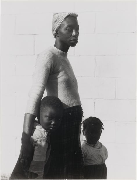 From curator Karen Haas: "Consuelo Kanaga was a member of the radical New York Photo League during the 1930s and thereafter developed a reputation as a white documentary photographer with a passion for social justice and deep sympathy for her often African American subjects. This powerful image of a rail-thin migrant worker in Florida with her two children clinging to her sides was featured in the MoMA's Family of Man exhibition (1955) under the title, 'She is a Tree of Life to Them.'"