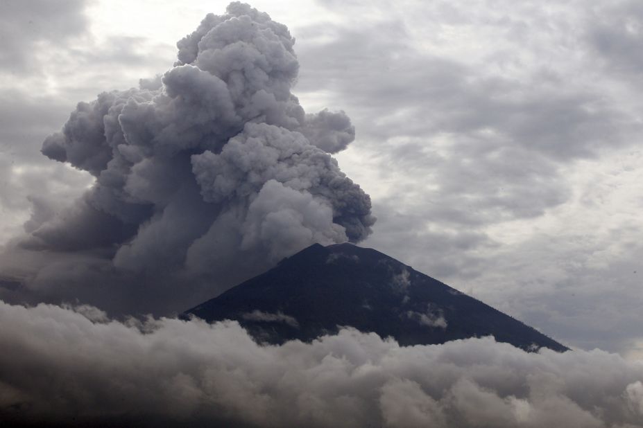 Clouds of ashes rise from the Mount Agung volcano erupting in Karangasem, Bali, Indonesia, Tuesday, November 28. The  volcano erupted for the first time in more than half a century, forcing closure of the Indonesian tourist island's busy airport and forcing tens of thousands from their homes. 