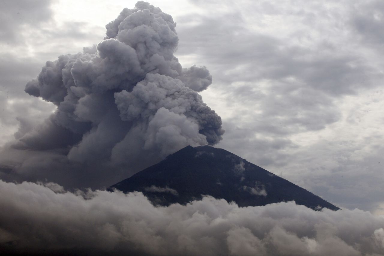 Clouds of ashes rise from the Mount Agung volcano erupting in Karangasem, Bali, Indonesia, Tuesday, November 28. The volcano erupted for the first time in more than half a century, forcing closure of the Indonesian tourist island's busy airport and forcing tens of thousands from their homes.