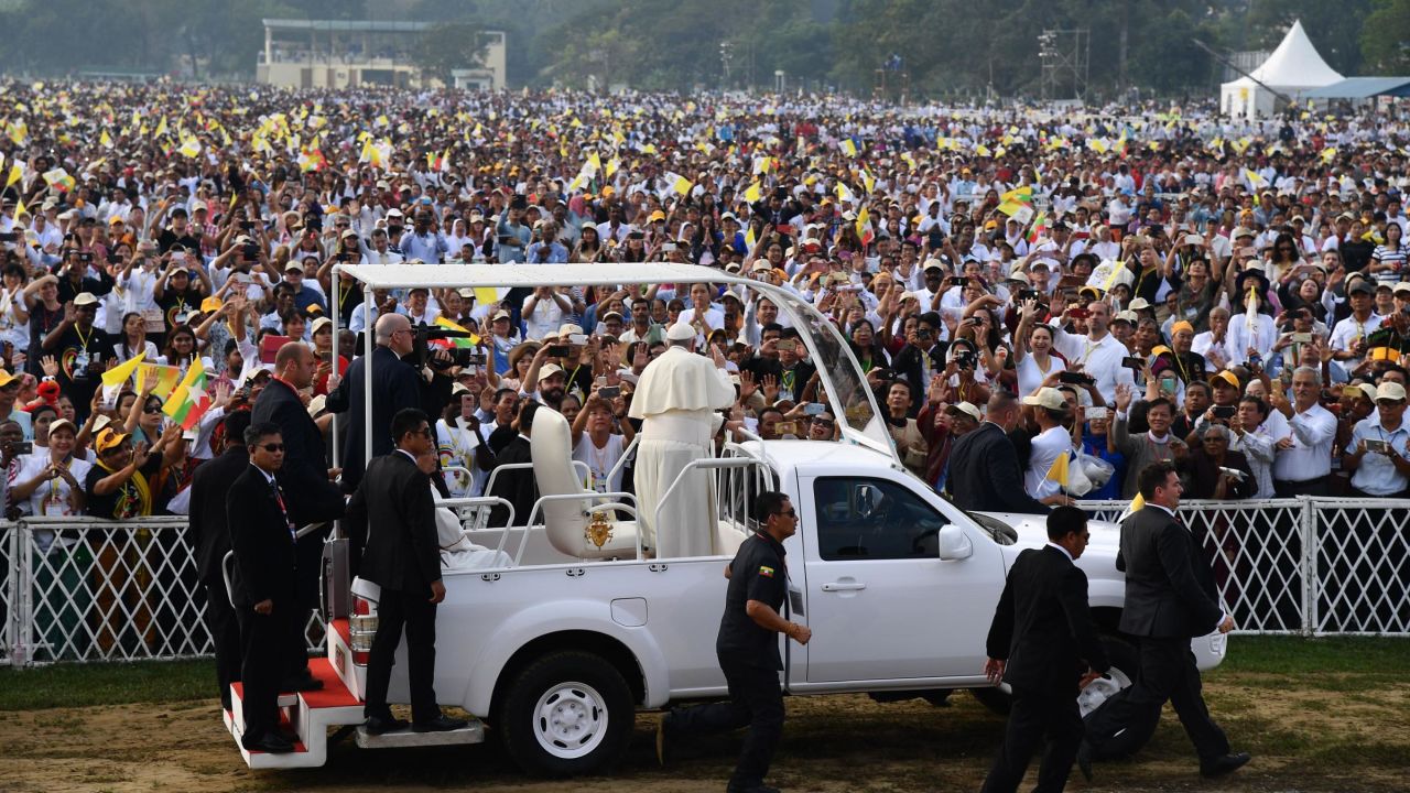 Pope Francis waves to Myanmar Catholic well wishers prior to an open air mass in Yangon on November 29, 2017.