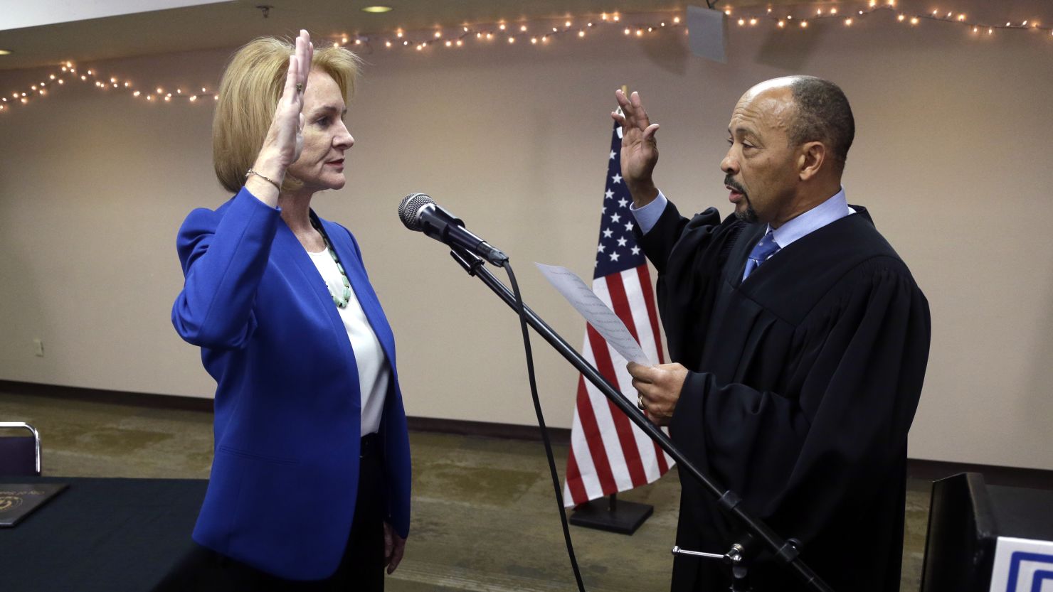 Jenny Durkan is administered the oath of office for Seattle mayor by US District Court Judge Richard A. Jones on Tuesday. 