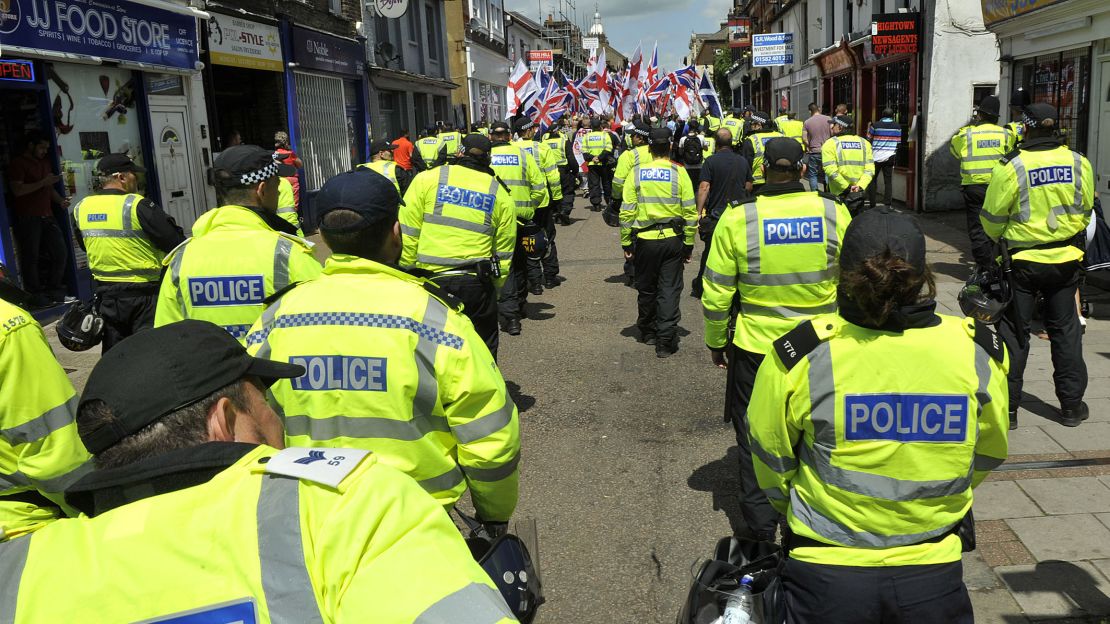 Police officers monitor a Britain First protest march in Luton, England, in June 2015.