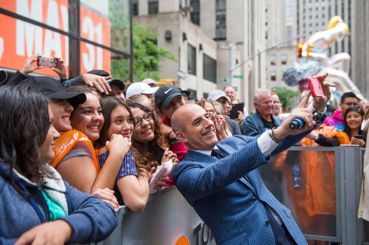 Lauer takes a selfie photo with fans on May 31.