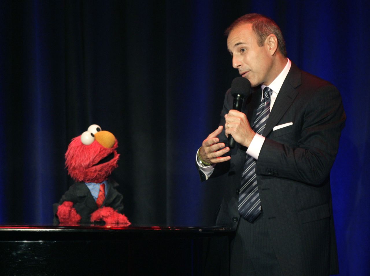 Lauer speaks with Elmo at the Sesame Workshop's Fifth Annual Benefit Dinner in New York in May 2007.