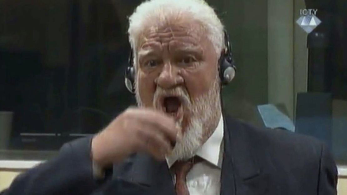 Crotian Former General Slobodan Praljak drinking a small bottle of liquid during a Yugoslav War Crimes Tribunal in The Hague on November 29.